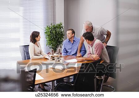 Stock Photograph - Business people in meeting. Fotosearch