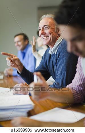 Stock Photography - Business people in meeting. Fotosearch
