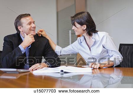 Business people laughing in office View Large Photo Image Stock Image - Business people laughing in office. Fotosearch