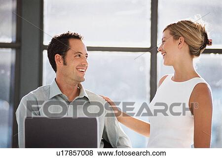 Business people laughing together View Large Photo Image Stock Photo - Business people laughing together. Fotosearch