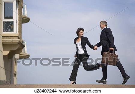 Business people running on street View Large Photo Image Picture - Business people running on street. Fotosearch