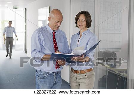 Business people signing papers in office View Large Photo Image Stock Image - Business people signing papers in office. Fotosearch