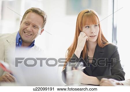 Business people sitting in meeting View Large Photo Image Stock Image - Business people sitting in meeting. Fotosearch