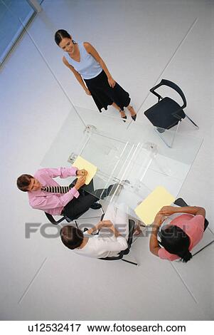 Business people sitting in meeting View Large Photo Image Stock Photo - Business people sitting in meeting. Fotosearch