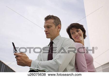 Business people sitting outdoors View Large Photo Image Stock Photo - Business people sitting outdoors. Fotosearch