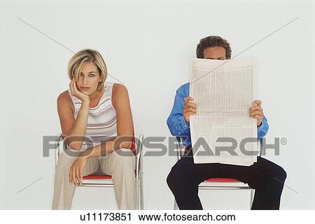 Stock Image - Business people sitting together. Fotosearch