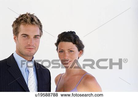 Stock Photo - Business people smiling together. Fotosearch