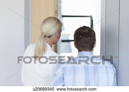 Business people standing in office View Large Photo Image Stock Image - Business people standing in office. Fotosearch