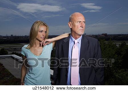 Business people standing on roof View Large Photo Image Stock Image - Business people standing on roof. Fotosearch