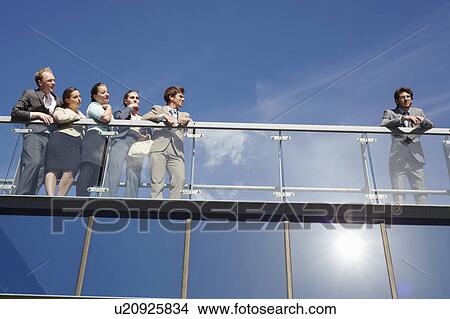 Business people standing on walkway View Large Photo Image Picture - Business people standing on walkway. Fotosearch