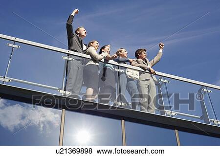 Stock Photo - Business people standing on walkway. Fotosearch
