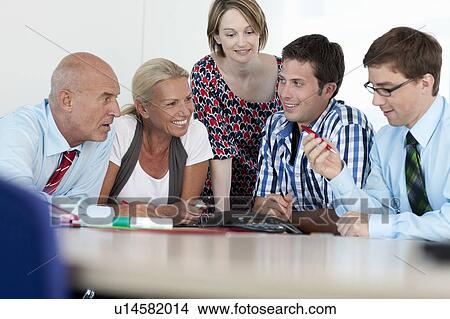 Picture - Business people talking in conference. Fotosearch