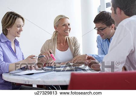 Stock Image - Business people talking in conference. Fotosearch