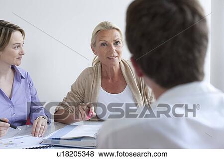 Business people talking in conference View Large Photo Image Stock Photo - Business people talking in conference. Fotosearch