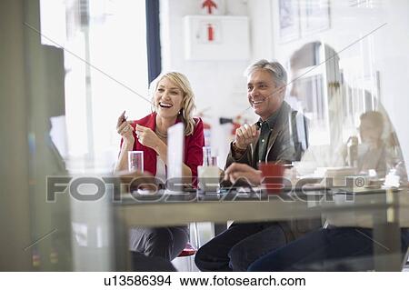 Picture - Business people talking in meeting. Fotosearch