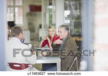 Business people talking in meeting View Large Photo Image Stock Photo - Business people talking in meeting. Fotosearch