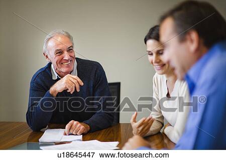 Stock Photo - Business people talking in meeting. Fotosearch