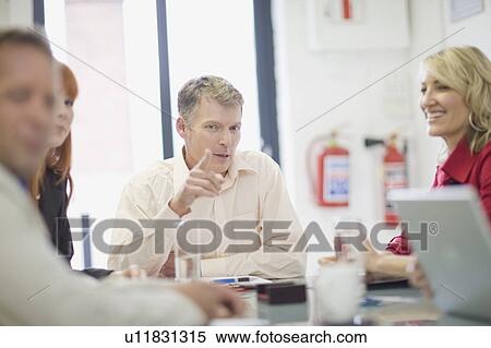 Business people talking in meeting View Large Photo Image Stock Photography - Business people talking in meeting. Fotosearch