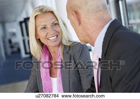 Business people talking in office View Large Photo Image Picture - Business people talking in office. Fotosearch