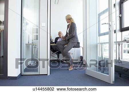 Business people talking in office View Large Photo Image Stock Image - Business people talking in office. Fotosearch