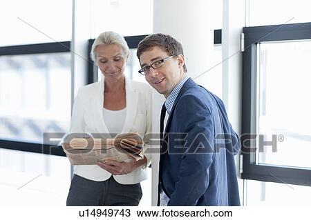 Business people talking in office View Large Photo Image Stock Image - Business people talking in office. Fotosearch