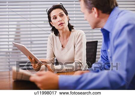 Business people talking in office View Large Photo Image Stock Photo - Business people talking in office. Fotosearch