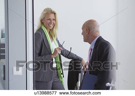Business people talking in office View Large Photo Image Stock Photo - Business people talking in office. Fotosearch