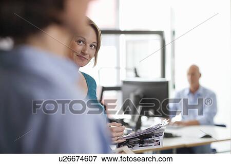 Business people talking in office View Large Photo Image Stock Photo - Business people talking in office. Fotosearch