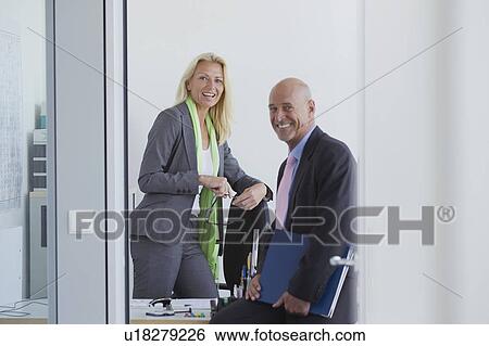 Stock Photograph - Business people talking in office. Fotosearch