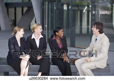 Business people talking on bench View Large Photo Image Picture - Business people talking on bench. Fotosearch