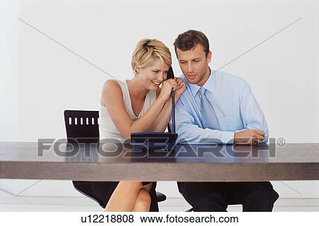 Stock Photo - Business people talking on telephone. Fotosearch