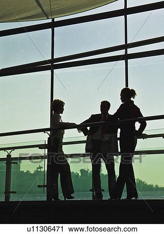 Business people talking on walkway View Large Photo Image Stock Image - Business people talking on walkway. Fotosearch