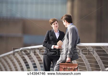 Business people talking outdoors View Large Photo Image Stock Photograph - Business people talking outdoors. Fotosearch