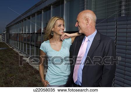 Business people talking outdoors View Large Photo Image Stock Photography - Business people talking outdoors. Fotosearch