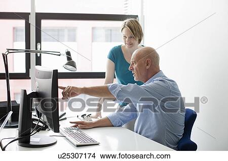 Business people using computer in office View Large Photo Image Picture - Business people using computer in office. Fotosearch