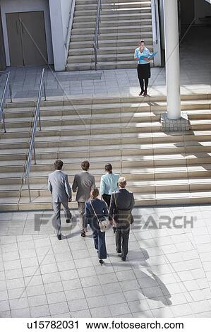 Business people walking on steps View Large Photo Image Stock Image - Business people walking on steps. Fotosearch