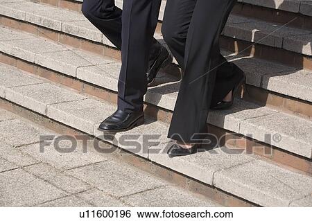 Business people walking on steps View Large Photo Image Stock Photograph - Business people walking on steps. Fotosearch