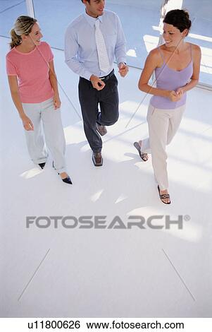 Stock Photograph - Business people walking together. Fotosearch