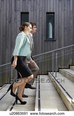 Business people walking up steps View Large Photo Image Stock Image - Business people walking up steps. Fotosearch