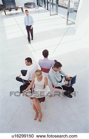 Business people working in lobby View Large Photo Image Stock Image - Business people working in lobby. Fotosearch