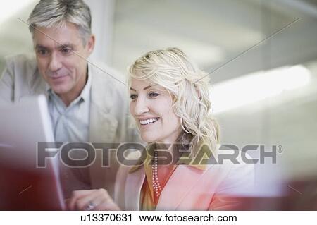 Business people working in office View Large Photo Image Stock Image - Business people working in office. Fotosearch