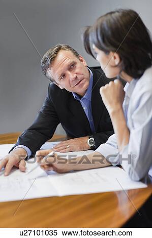 Stock Photography - Business people working in office. Fotosearch