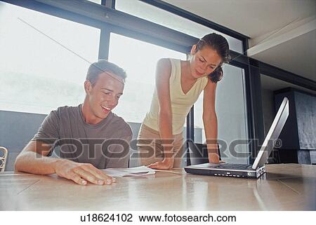 Business people working on laptop View Large Photo Image Stock Image - Business people working on laptop. Fotosearch