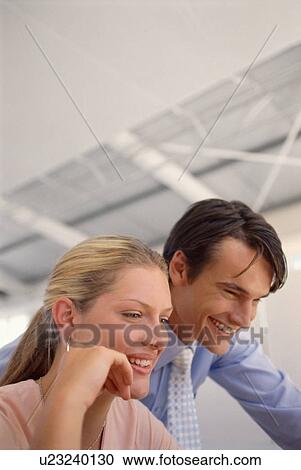 Stock Image - Business people working together. Fotosearch