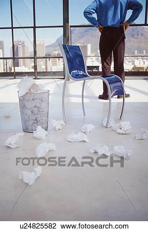 Businessman crumpling papers in office View Large Photo Image Stock Image - Businessman crumpling papers in office. Fotosearch