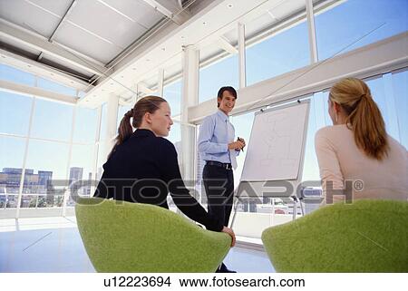 Businessman giving presentation View Large Photo Image Picture - Businessman giving presentation. Fotosearch