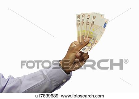 Stock Photo - Businessman holding Euro notes. Fotosearch