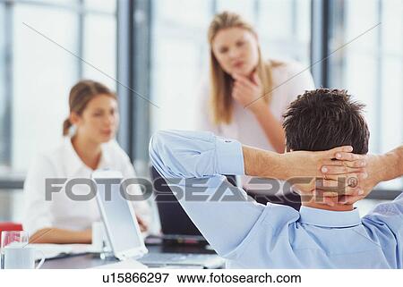 Businessman relaxing at desk View Large Photo Image Stock Photo - Businessman relaxing at desk. Fotosearch