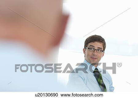 Businessman sitting in conference View Large Photo Image Stock Image - Businessman sitting in conference. Fotosearch