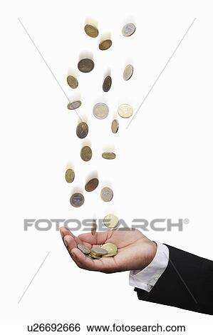 Stock Photograph - Businessman tossing Euro coins. Fotosearch
